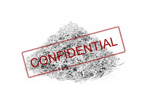 DJ Hanley Confidential Paper Shredding. A pile of shredded paper with confidentiality written in red.